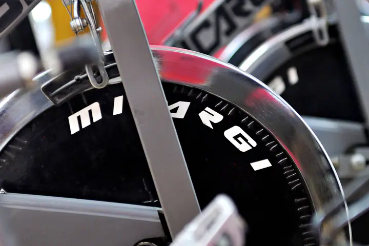 Indoor cycling bikes lined up in a studio