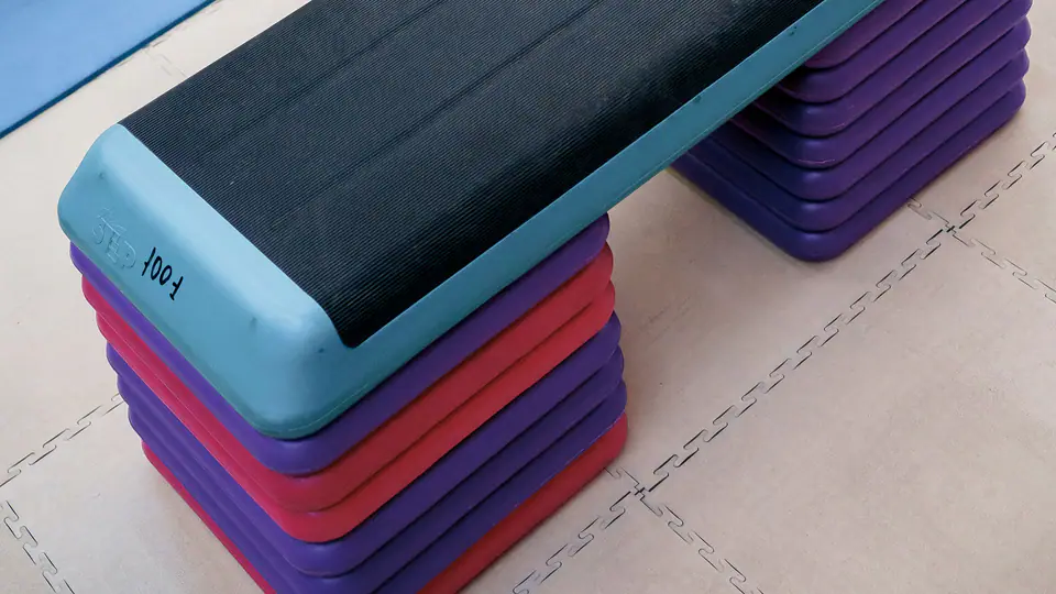 Aerobic step platforms and an exercise mat in a studio